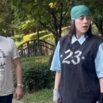 American singer Billie Eilish went viral after her surprised reaction to a shoe cleaning spray during her visit to South Korea. The video sparked discussions about cultural differences and highlighted the beauty of Seoul's natural surroundings.