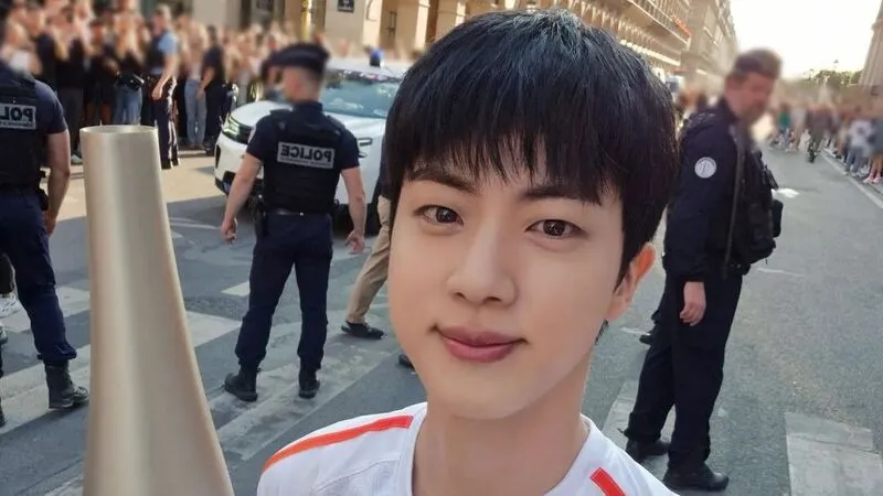 BTS member Jin made history at the 2024 Paris Olympics by carrying the torch within the Louvre Museum on Bastille Day. His interview was conducted in Korean, highlighting Korea's growing global influence.