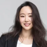 The dismissal of Min Heejin from Ador's CEO position was announced by HYBE, with Kim Joo-young taking over as the new CEO. Despite the dismissal, Min Heejin will remain a board director and continue producing for NewJeans.