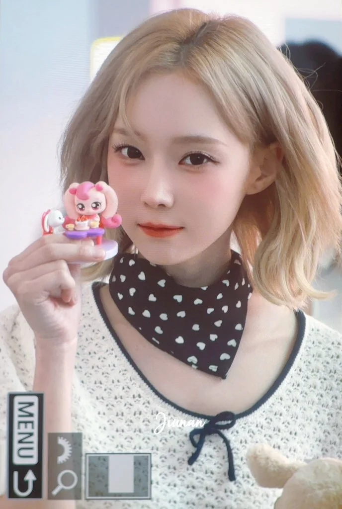 Winter's photo with a cuddly doll beautifully showcases her innocent and adorable charm.