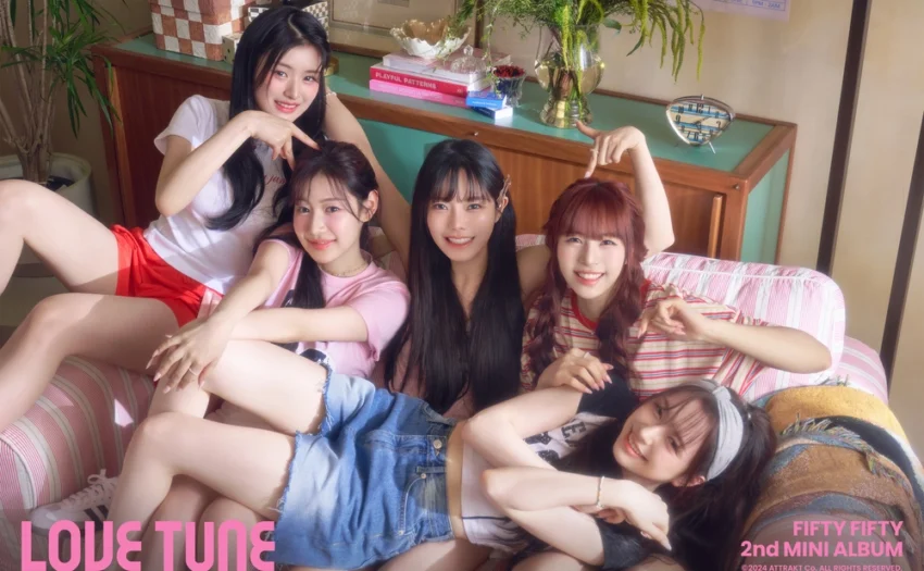 FIFTY FIFTY revealed their new Love Tune concept photo, showcasing the members’ bright smiles and close bond. The cozy setting and pink-themed decor highlighted the group’s vibrant and playful energy.