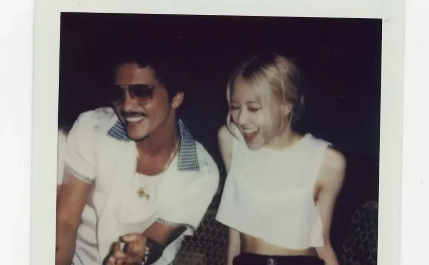 Rosé and Bruno Mars collaborated on the duet "APT.," a song inspired by a popular Korean drinking game. The music video showcased their playful interaction, contributing to its success on platforms like YouTube and Melon.