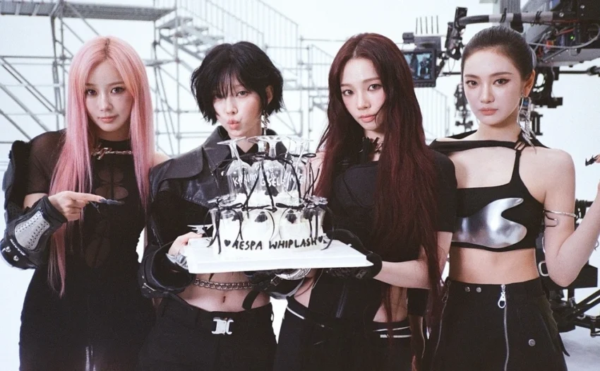 aespa album Whiplash achieved over 1 million sales in its first week, marking their fifth consecutive million-seller. The album spans various genres, including EDM-based techno, showcasing aespa’s musical range.